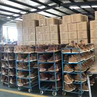 Bottes hautes en cuir noir gaufré avec semelle extérieure en caoutchouc Goodyear
