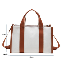 Nouveau design de sac fourre-tout en toile léger et tendance sac fourre-tout à bandoulière imperméable de grande capacité avec poignées renforcées