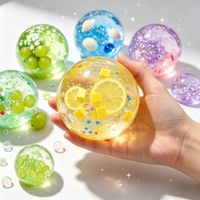 Balle anti-stress de Noël en TPR, transparente, à paillettes, élastique, faite à la main, avec sable mouvant et effet boule de cristal