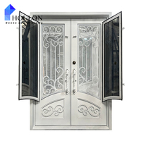 Porte d'entrée double moderne en fer forgé blanc avec décorations festonnées et verre trempé transparent pour villa