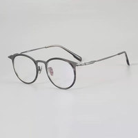 Nouveauté Lunettes rétro en titane pur Déstockage Lunettes en titane de haute qualité Assortiment de montures de lunettes en titane