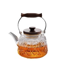 Théière en verre à haute teneur en borosilicate de style nouveau poignée noire transparente bégonia intégrée gris fumée pour bouilloire à thé bouillante à la vapeur