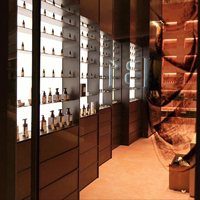 Parfumerie unique Comptoir présentoir de parfums en marbre à design d'intérieur Placage de bois Armoire à parfums arquée