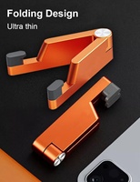 Accessoires pour téléphone Ningbo directement de l'usine, support de téléphone portable pliable en silicone en forme de V, support portable pour téléphone et mini-tablette