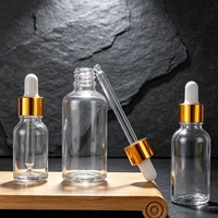 Vente en gros d'usine - Flacon compte-gouttes en verre transparent 10ml 20ml 30ml 50ml 100ml - Flacon vide pour huile essentielle avec bouchon compte-gouttes en aluminium doré