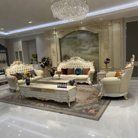 Ensemble de canapés en cuir véritable en bois massif de style européen, luxe haut de gamme, salon, villa, grand appartement, pieds en feuille d'or blanc brillant