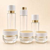Nuevo juego de cuidado de la piel con bomba rotativa de 100ml botella de esencia de loción de agua de vidrio 50g botella cosmética de crema facial