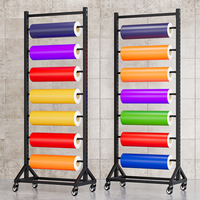 Support d'affichage métallique multifonctionnel personnalisable de style moderne pour rouleaux de tapis et tissus noirs