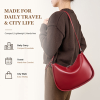 Sac croissant d'épaule en cuir véritable pour femme, style luxe discret, texture Napa lisse, sac lune, en stock, marque privée, logo ODM