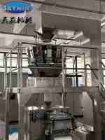 Machine d'emballage verticale en acier inoxydable avec commande PLC pour le remplissage et la fermeture de sachets de biscuits et de gâteaux