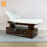 Table de massage professionnelle haut de gamme pour spa et institut de beauté, avec fonction chauffante et mousse à mémoire de forme, idéale pour centres de bien-être et salons de manucure.