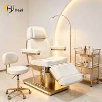 Table de massage électrique réglable pour salon de beauté avec base en métal pour usage hôtelier