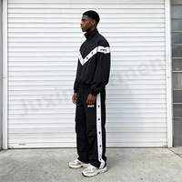 Ensemble de survêtement personnalisé pour homme en nylon, coupe oversize, avec broderie, veste coupe-vent résistante à l'eau à blocs de couleur et pantalon large à jambes larges
