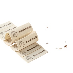 Cotton-woven <b>label</b> with laser-cut edges; <b>machine</b>-washable; <b>printed</b> <b>label</b> for apparel, footwear, and bags - Product Image 1