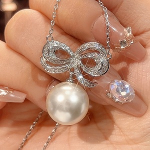 Ensemble de bijoux élégant et écologique en cuivre avec perles de coquillage de 14 mm, design nœud papillon, boucles d'oreilles et collier pour femmes, vente en gros - Product Image 5