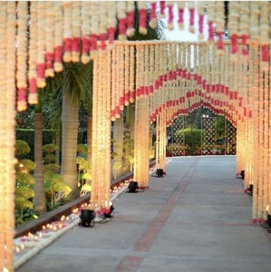 Elegant Plastic <b>Wedding</b> <b>Arch</b> Decoration with Hanging Beads and Red Accents for Outdoor Ceremony Setup - Product Image 1