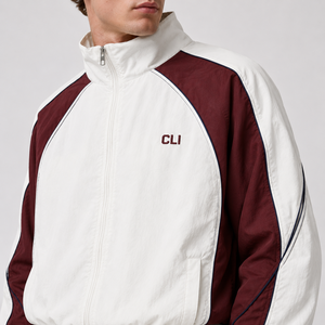 Survêtement color block de haute qualité avec logo brodé personnalisé, veste coupe-vent imperméable à fermeture éclair intégrale et pantalon de survêtement à empiècements contrastants - Product Image 2