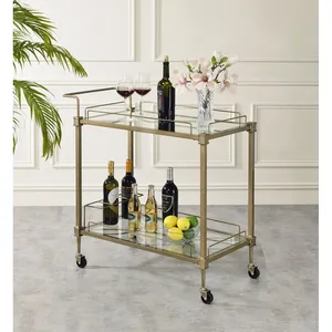 Chariot de bar en métal doré avec étagères en verre et roulettes, design rectangulaire glamour pour les fêtes - Product Image 1