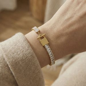 Pulsera de tenis de acero inoxidable chapada en oro PVD de 18 quilates, impermeable, con circonitas, joyería premium - Product Image 1