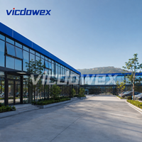 VICDOWEX Maison préfabriquée de luxe intégrée en forme de T avec fenêtres en aluminium pour usage commercial et bureautique contemporain