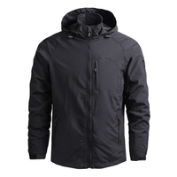 Veste à capuche unisexe noire en softshell, légère, imperméable, coupe-vent, éco-responsable, avec fermeture éclair et poches, idéale pour le printemps et les activités de plein air.