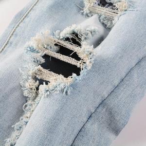 กางเกงยีนส์สีดำสำหรับผู้ชาย ทรงสลิมฟิต ผ้ายีนส์ยืด ลุควินเทจ ขาดๆ แบบดิสเทรส สไตล์สตรีทแฟชั่น ดีไซน์เนอร์ - Product Image 5