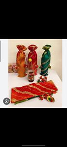 Festive handcrafted <b>potli</b> bottle <b>bags</b> set featuring elegant silk-blend fabric with rich zari wave patterns - Product Image 2