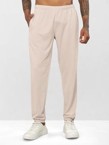 Pantalon de jogging en coton beige pour homme, taille élastique, poches latérales, coupe décontractée, longueur complète, couleur unie, idéal pour le printemps - Product Image 4