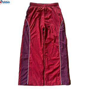 Pantalones Deportivos de Moda Personalizados, Pantalones Deportivos de Nylon con Diseño de Bloques de Color Personalizados, Corte Holgado y Pierna Ancha para Hombre - Product Image 1