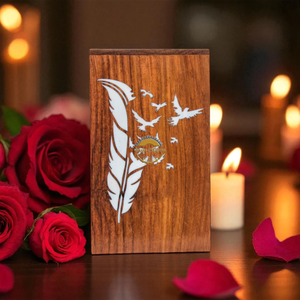 Urne funéraire artisanale en bois naturel avec motif de feuilles découpées et vague blanche, fabriquée à la main par AYAANS - Product Image 1