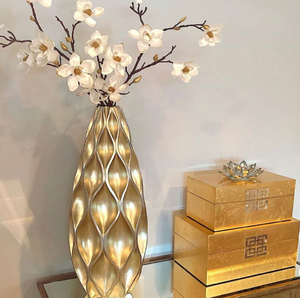 Luxury embossed <b>gold</b> teardrop centerpiece styled with white blooming branches, available at wholesale prices. - Product Image 1