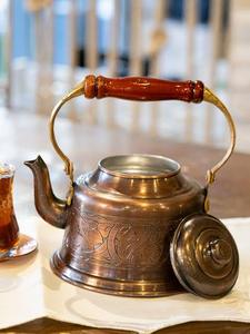 Vintage Metal Tea <b>Kettle</b> <b>With</b> <b>Wooden</b> <b>Handle</b> And Engraved Design For Traditional Tea Serving - Product Image 1