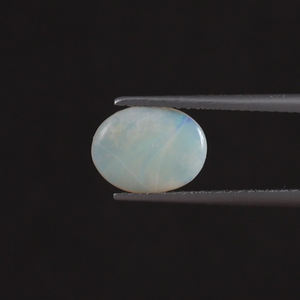โอปอลธรรมชาติสีขาวคุณภาพดี รับรองโดย IGI น้ำหนัก 1.05 กะรัต รูปทรงวงรี 10x8 มม. ตัดด้วยมือ ขัดเงา ลงแว็กซ์/น้ำมัน - Product Image 1