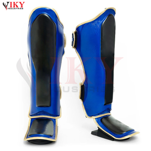 Protections de tibia personnalisées bicolores bleu et noir avec bordure dorée métallique, équipement d'arts martiaux haute performance, fabricant - Product Image 1