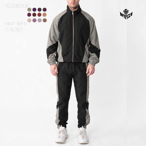 Ensemble de survêtement coupe-vent pour homme, veste légère à fermeture éclair, pantalon de jogging, vêtements de sport, logo personnalisé OEM, vente en gros - Product Image 1