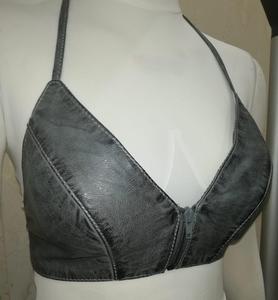 beige or light yellow leather-style halter top featuring a front zipper closure and distressed brown edging bra - Product Image 6