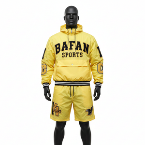 ชุดเซ็ตเสื้อแจ็คเก็ตและกางเกงขาสั้นผู้ชาย ผ้าไนลอนโพลีเอสเตอร์คุณภาพพรีเมียม สีเหลือง สำหรับเล่นกีฬา รับสกรีนโลโก้ มีไซส์ใหญ่พิเศษ - Product Image 1