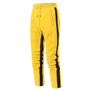 Pantalones deportivos casuales de poliéster amarillo para hombre, con forro polar, antipilling, cintura elástica con cordón, tiro medio, ligeros, para otoño - Product Image 1