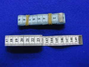 เทปวัดระยะ PVC/PE รุ่น DK-410 |   ตลับเมตรพลาสติกพกพา 150 ซม. สีขาว ปลายโลหะ สำหรับงานเย็บผ้าและงานฝีมือ - Product Image 1