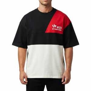 เสื้อยืดคอกลมแขนสั้นผู้ชาย E INTERNATIONAL ผ้าคอตตอนเจอร์ซีย์สีสันตัดต่อแบบลำลอง พร้อมดีไซน์ลายปะติด - Product Image 1