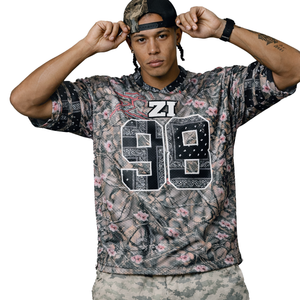 Maillot de football américain en maille respirante, coupe oversize, style streetwear, imprimé camouflage floral, en polyester, personnalisable pour équipes - Product Image 1