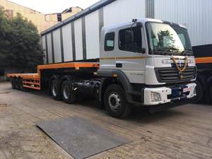 Fournisseur indien de remorques semi-basses pour le transport de marchandises et utilitaires, rampes hydrauliques, col de cygne détachable pour un chargement et un déchargement faciles, en vente - Product Image 3