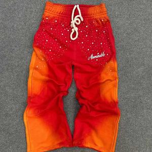 Pantalones Deportivos para Hombre en Degradado Rojo Naranja con Pedrería, Cintura Elástica con Cordón, Estilo Casual, Logotipo Abominable - Product Image 1
