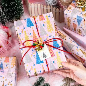 Carta da Regalo Natalizia Rosa Reversibile con Tema Albero e Fiocchi di Neve in Lamina Metallica per Regali da Ragazza - Product Image 1