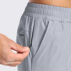 Shorts pour hommes gris clair à séchage rapide avec cordon de serrage et poches, tenue décontractée, nouveau modèle simple pour la gym, shorts pour garçons et hommes, tissu 100% polyester doux. - Product Image 3
