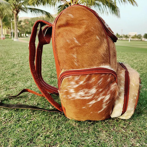 Premium cowhide leather hair on school <b>backpacks</b> wholesale supplier OEM custom handmade export student bags in wholesale price - Product Image 5