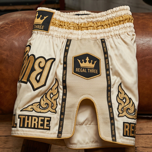 Pantalones Cortos de Muay Thai Regal Three Boxing, Color Dorado y Negro, Estampado por Transferencia de Calor, Unisex, 100% Poliéster Satinado - Product Image 4