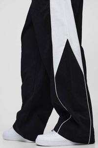 Pantalones de chándal unisex personalizados de pierna ancha, estilo baggy, con bloques de color, cortavientos, oversize, estilo hip hop, streetwear, techwear - Product Image 2