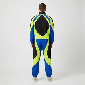 ชุดเซ็ตเสื้อแจ็คเก็ตและกางเกงวอร์มสตรีทแวร์พรีเมียมแบบสั่งทำพิเศษ น้ำหนักเบา ทรงโอเวอร์ไซส์ มีฮู้ด ตกแต่งด้วยผ้าแบบแพทช์เวิร์ค ระบายอากาศได้ดี ผลิตจากไนลอน - Product Image 2