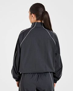 Ensemble de survêtement rétro noir pour femme, léger et respirant en polyester/spandex, idéal pour la course à pied - Vente en gros - Product Image 6